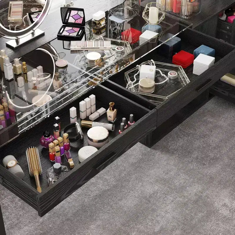Tocador moderno esquinero en forma de L, escritorio de maquillaje con superficie de vidrio templado negro, 5 cajones y estantes abiertos, para el dormitorio